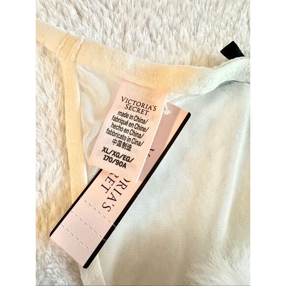 White sheer Victoria’s Secret thong new with tags with black bow detail and pom- - Picture 4 of 6